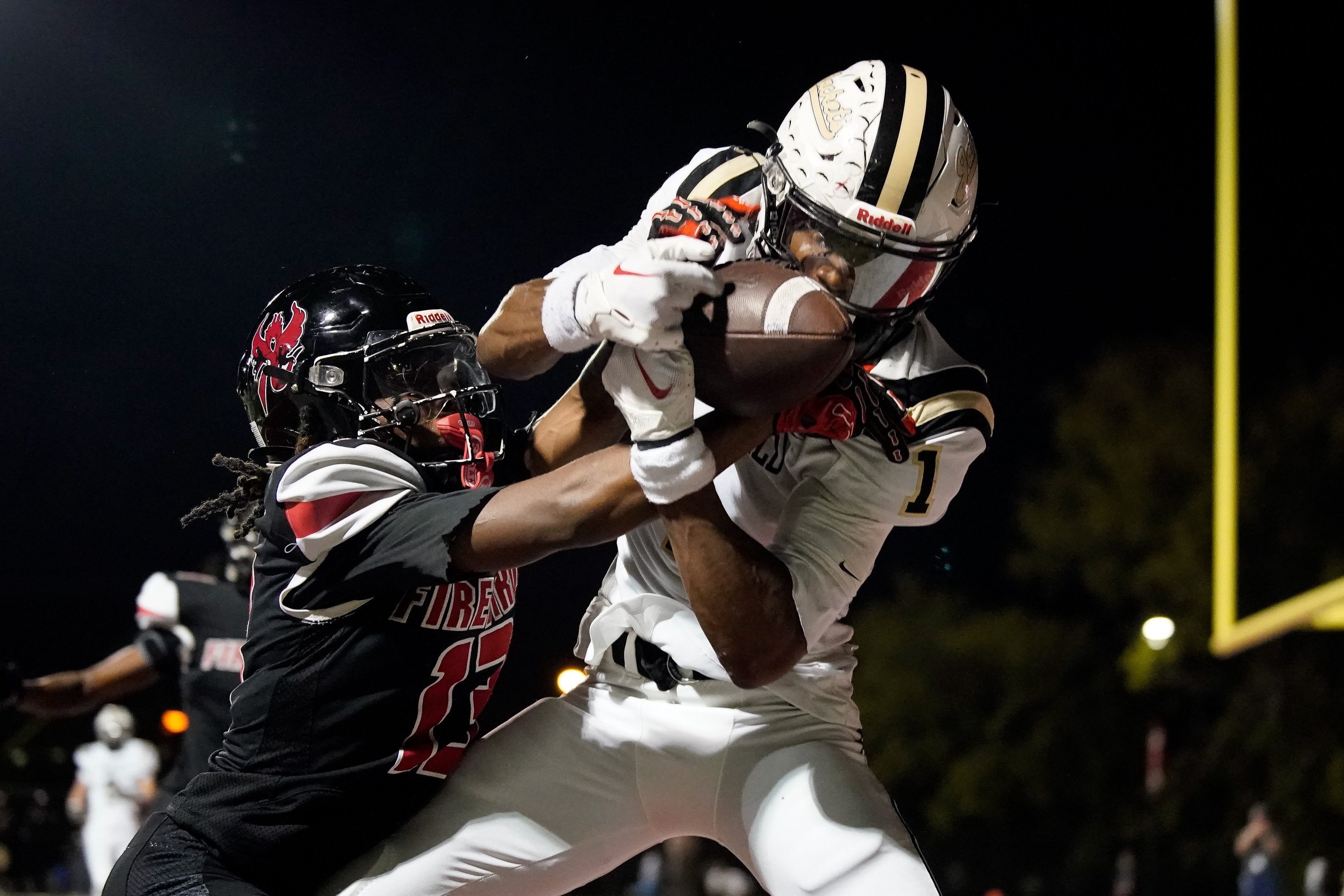 Springfield's Jermaine Cobbins (1) pulls in a touchdown past Pearl-Cohn's Deshawn Cotten (13) during the fourth quarter at Pearl-Cohn High School in Nashville, Tenn., Friday, Sept. 25, 2026.