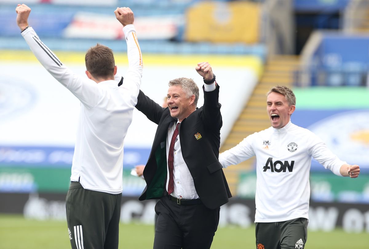 Coach Michael Carrick, Manager Ole Gunnar Solskjaer and Coach Kieran McKenna of Manchester United celebrate at the final whistle during the Premier League match between Leicester City and Manchester United at The King Power Stadium