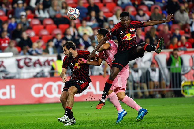 Inter Miami forward Luis Suarez, center, battles for the ball with New York Red Bulls defender Julian Bazan, right, and Devin Padelford during an MLS soccer match Saturday, Oct. 24, 2026, in Harrison, N.J. (AP Photo/Eduardo Munoz Alvarez)