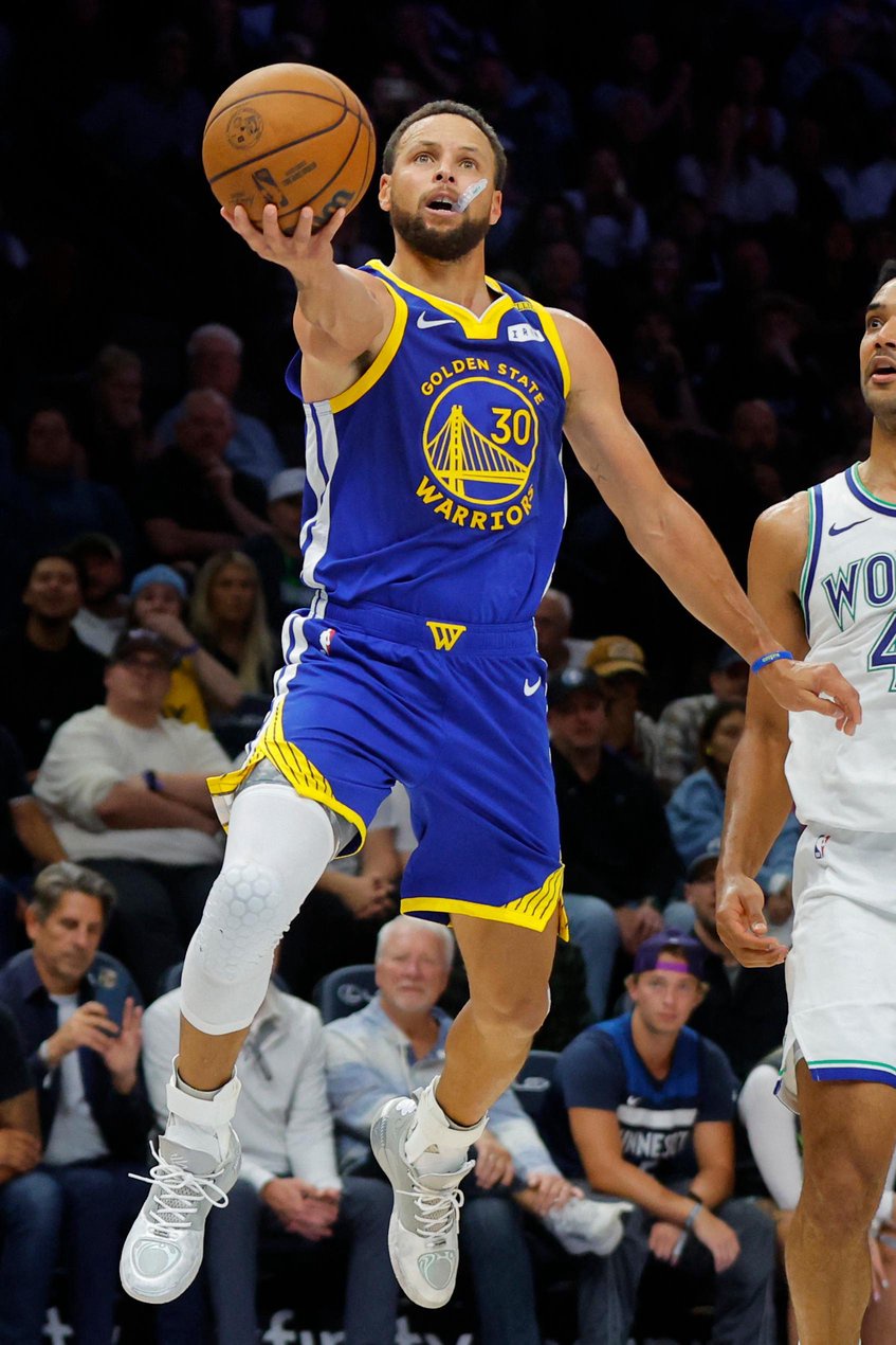 Golden State Warriors guard Stephen Curry drives to the basket against the Minnesota Timberwolves.