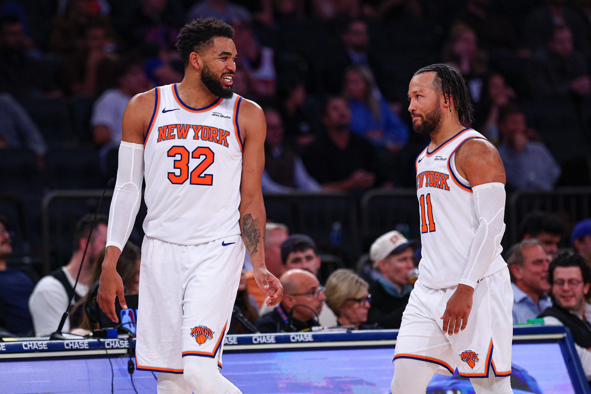New York Knicks center Karl-Anthony Towns (32) talks with point guard Jalen Brunson (11) during the second half against the Toronto Raptors at Madison Square Garden. 