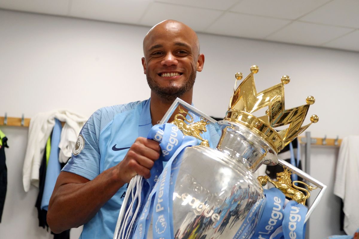 Vincent Kompany celebrates winning his fourth Premier League title with Manchester City
