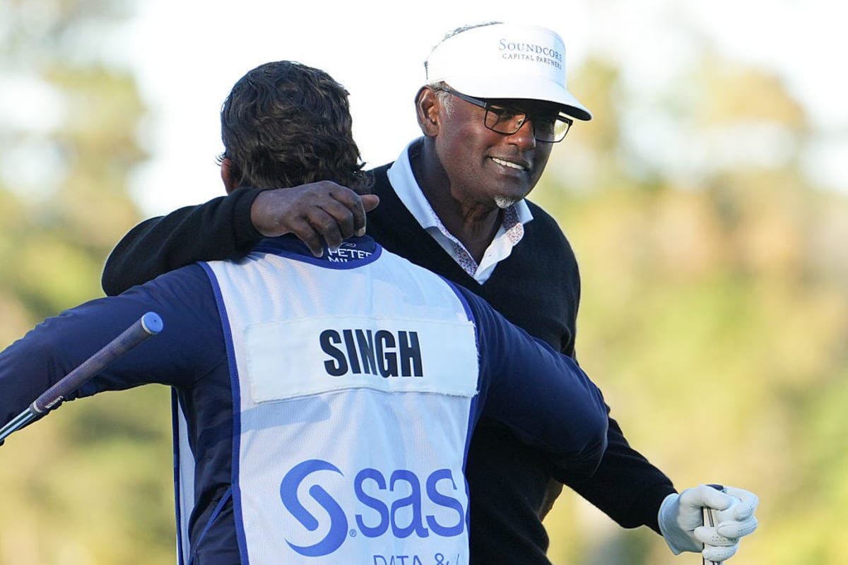 Vijay Singh of Ponte Vedra Beach hugs caddie Wayne De Haas on the 18th green of the Prestonwood Golf Club in Cary, N.C. on Oct. 18 after winning the PGA Tour Champions SAS Championship