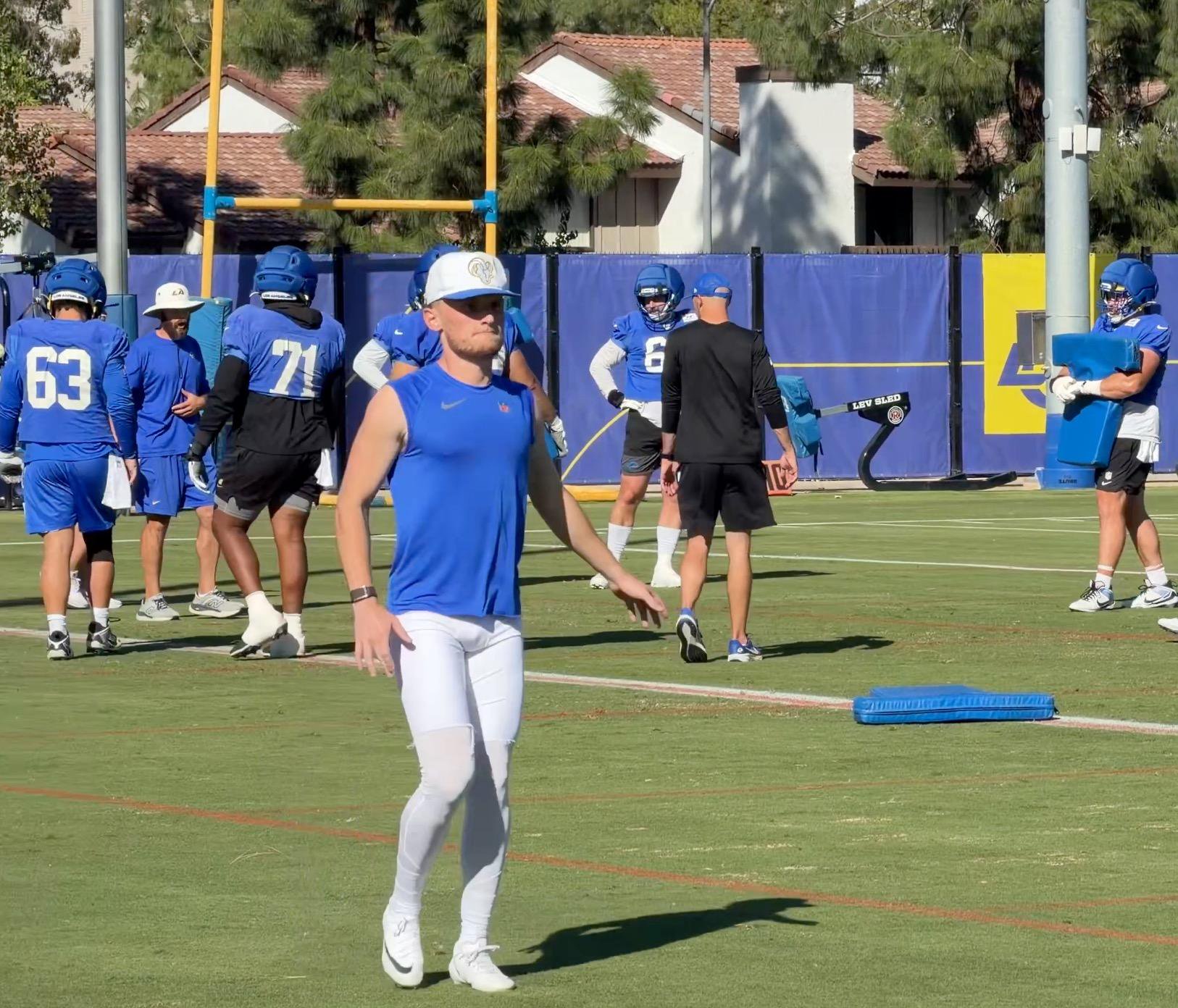 Blake Grupe on the practice field with other Rams players.