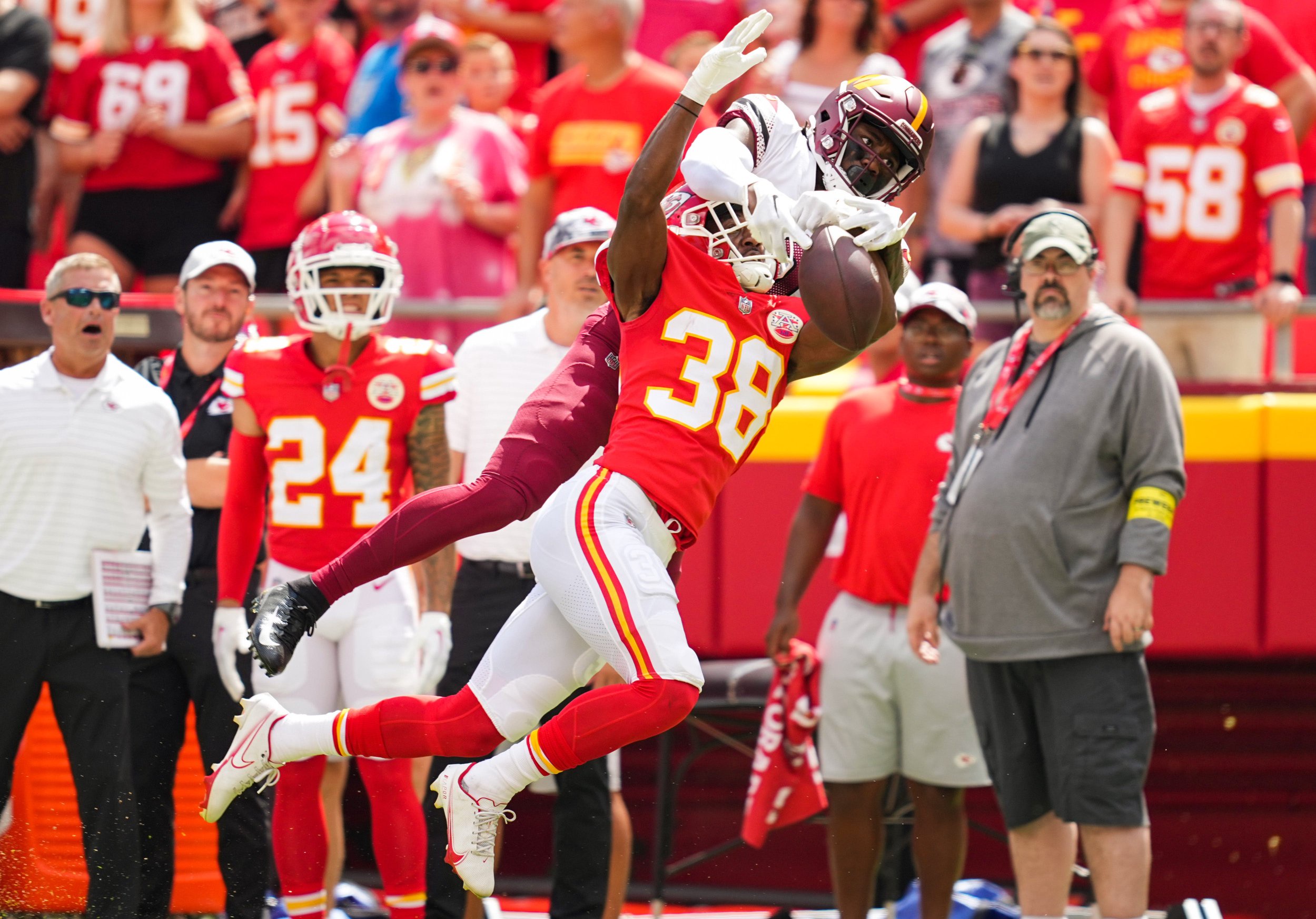 Aug 20, 2022; Kansas City, Missouri, USA; Kansas City Chiefs cornerback L'Jarius Sneed (38) breaks up a pass intended for Washington Commanders wide receiver Curtis Samuel (10) during the first half at GEHA Field at Arrowhead Stadium. Mandatory Credit: Jay Biggerstaff-USA TODAY Sports