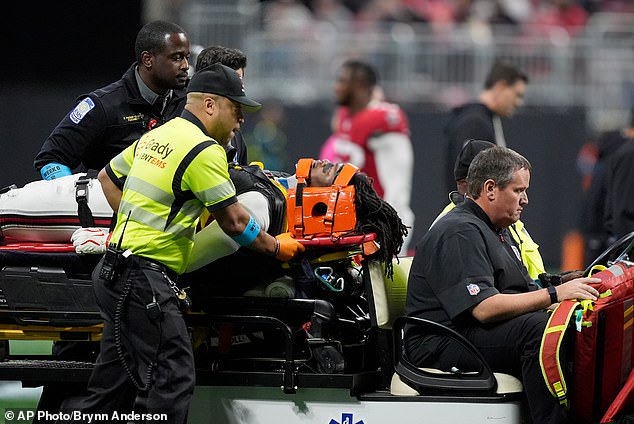 Atlanta Falcons linebacker Kendal Daniels had his jersey cut off of him by medical staff before being removed from the field on a stretcher during Sunday’s game