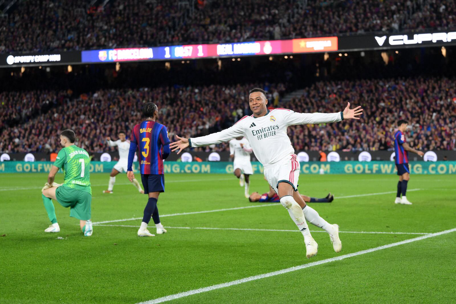 Kylian Mbappé acceps the acclaim after scoring his and Real Madrid's second goal against Barcelona at Camp Nou on Sunday. Photograph: David Ramos/Getty Images