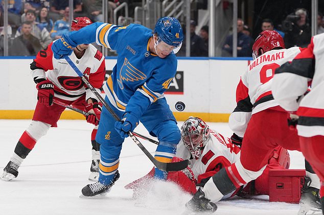 St. Louis Blues' Aleksanteri Kaskimaki (41) watches the puck as Carolina Hurricanes goaltender Pyotr Kochetkov, right, defends during the second period of an NHL hockey game Saturday, Oct. 24, 2026, in St. Louis. (AP Photo/Jeff Roberson)