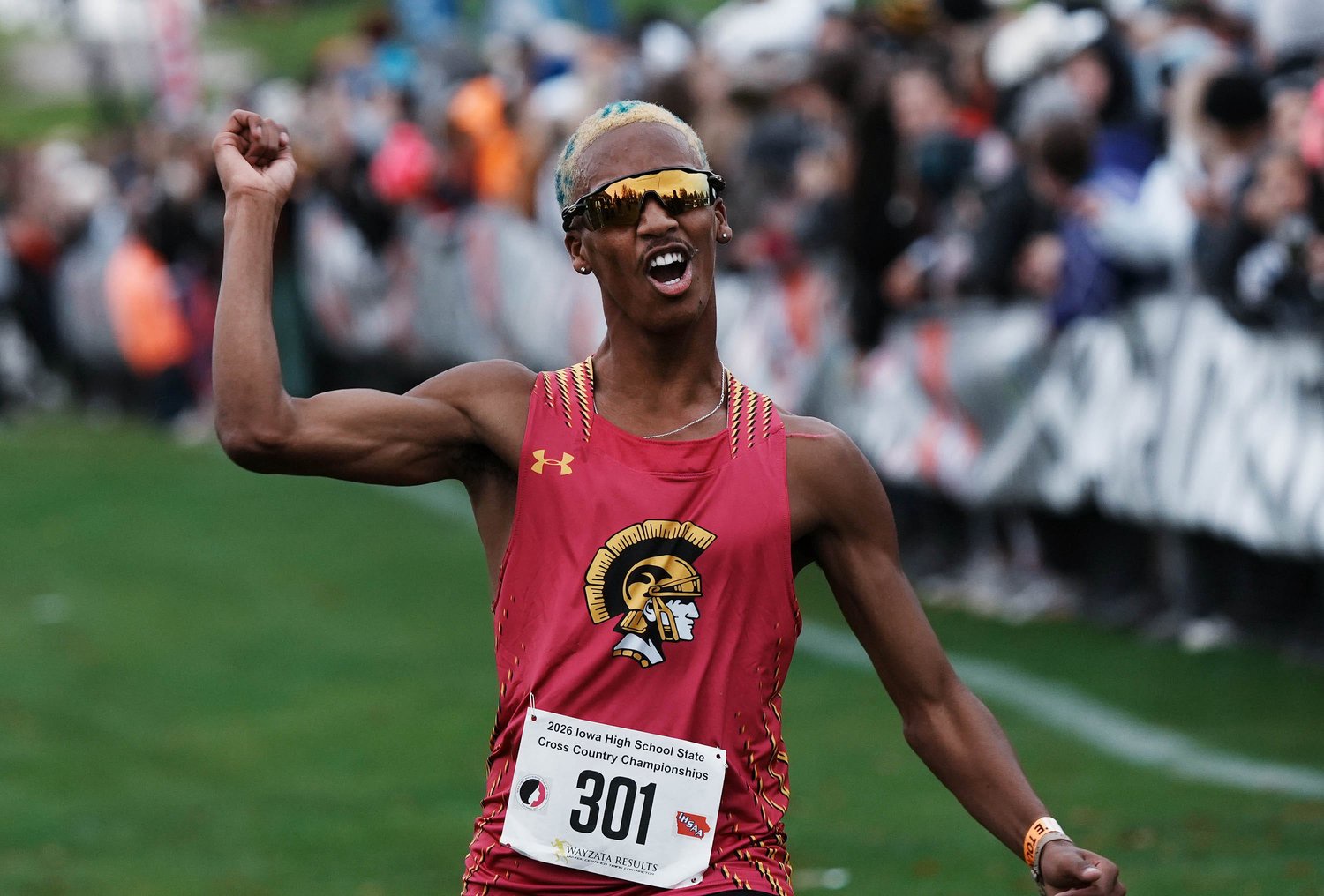 Tri-Center's Haven Weers celebrates after crossing the finish line and winning the Class 1A boys state cross country race at Lakeside Municipal Golf Course on Oct. 30, 2026, in Fort Dodge, Iowa.