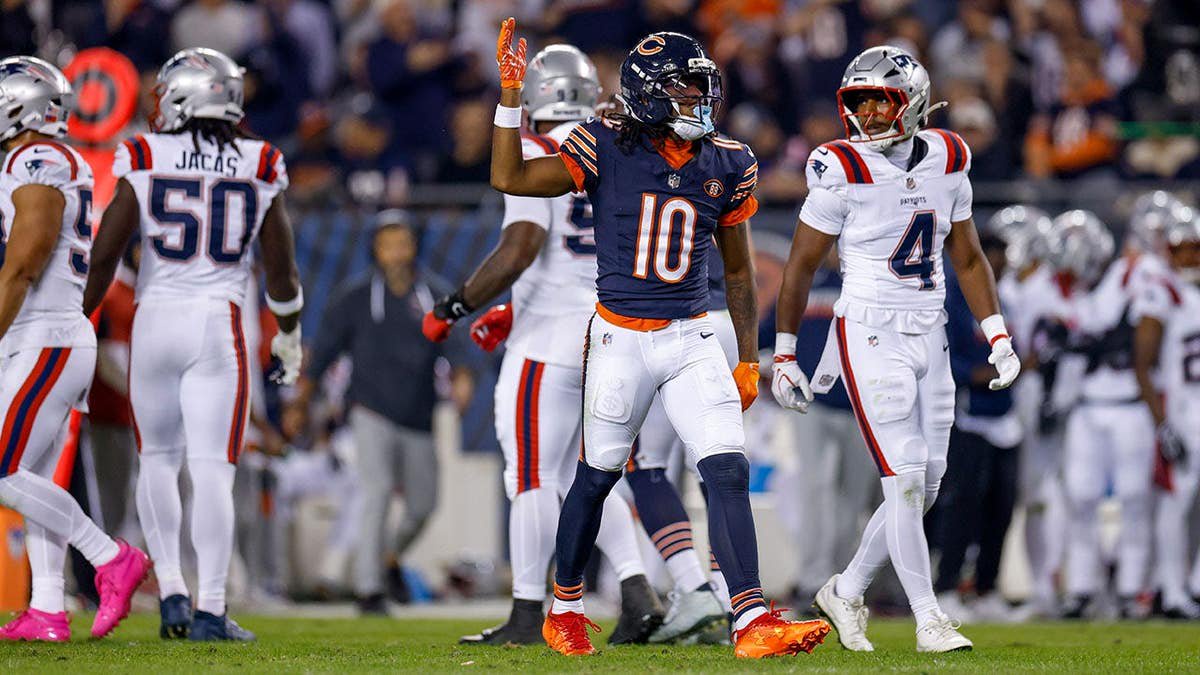 Luther Burden III #10 celebrates during the Bears game at Soldier Field.