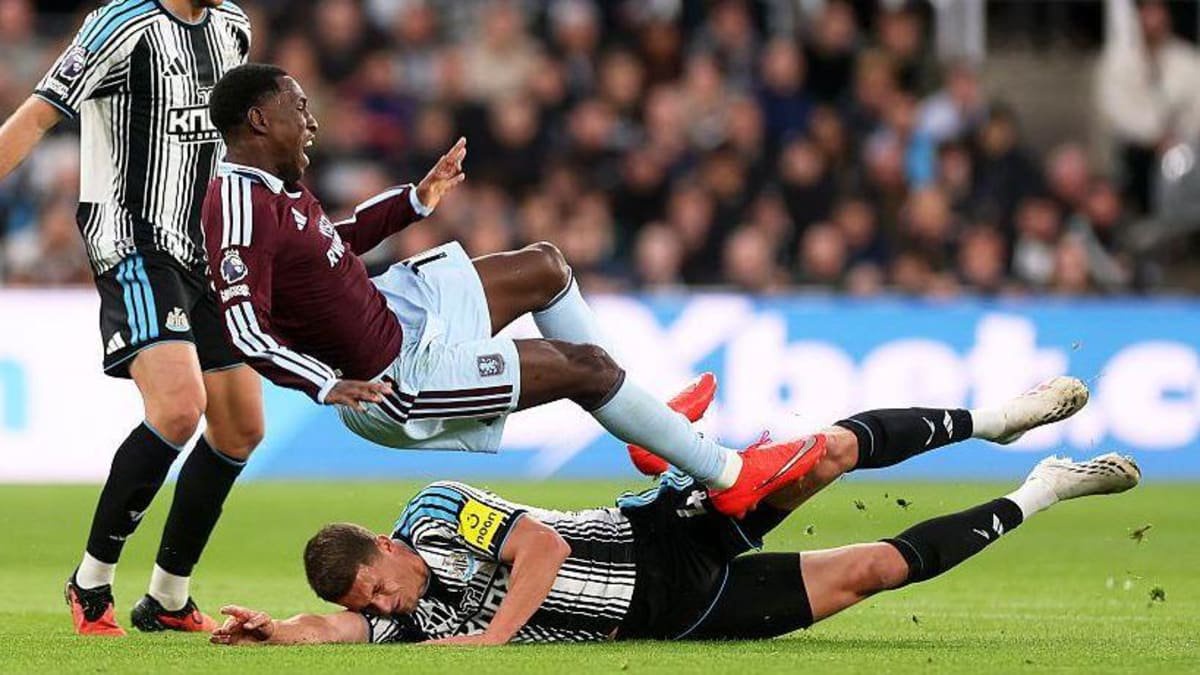 Nicolas Jackson of Aston Villa is fouled by Sven Botman