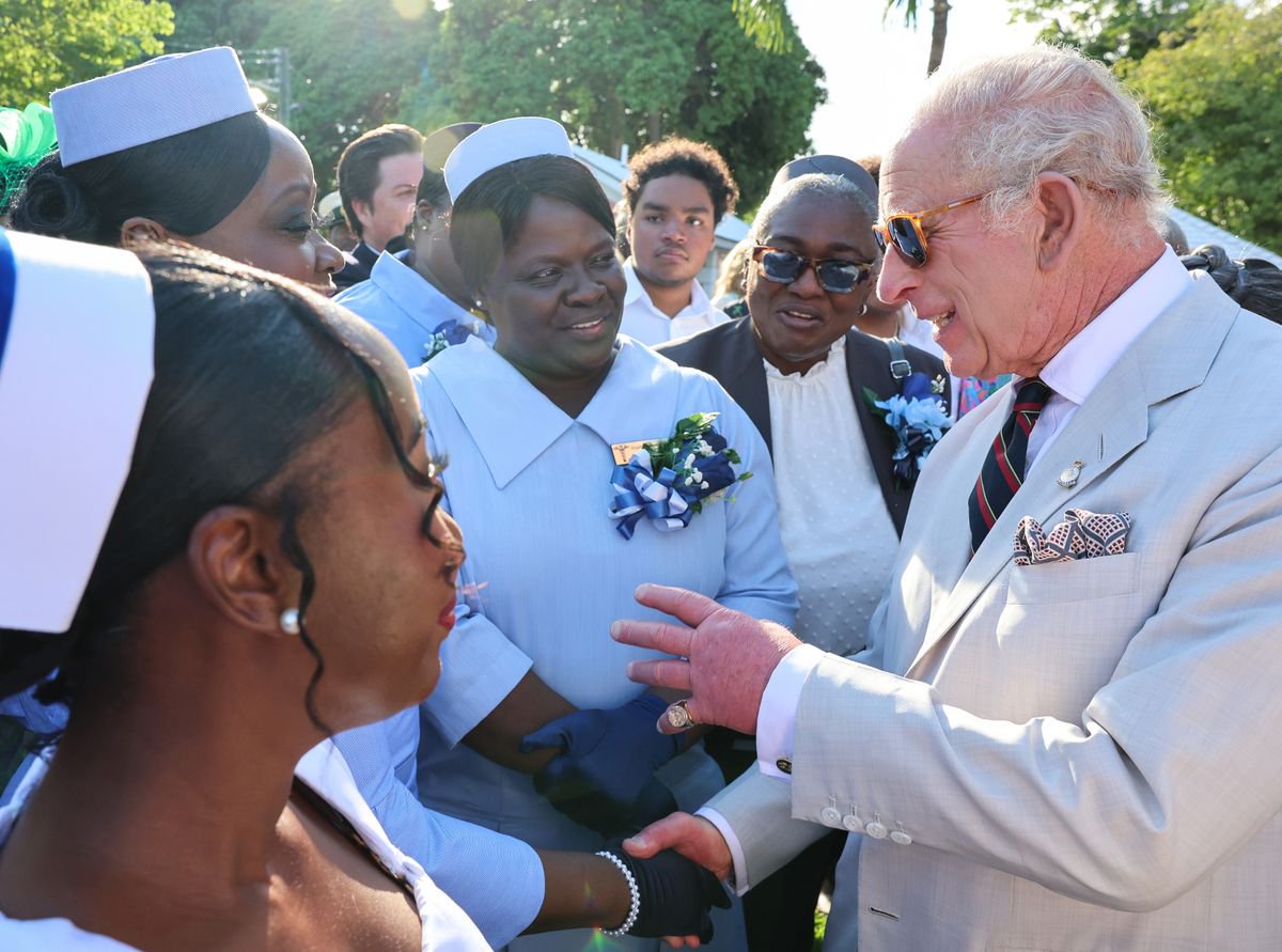 King Charles meets representatives of community and voluntary organisations as he attends a Garden Reception at Government House, Nassau