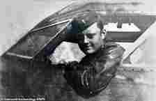 21-year-old Lieutenant John Fisher (pictured) steered a malfunctioning and out-of-control 'kamikaze' bomber  packed with 22,000lbs of explosives away from their home