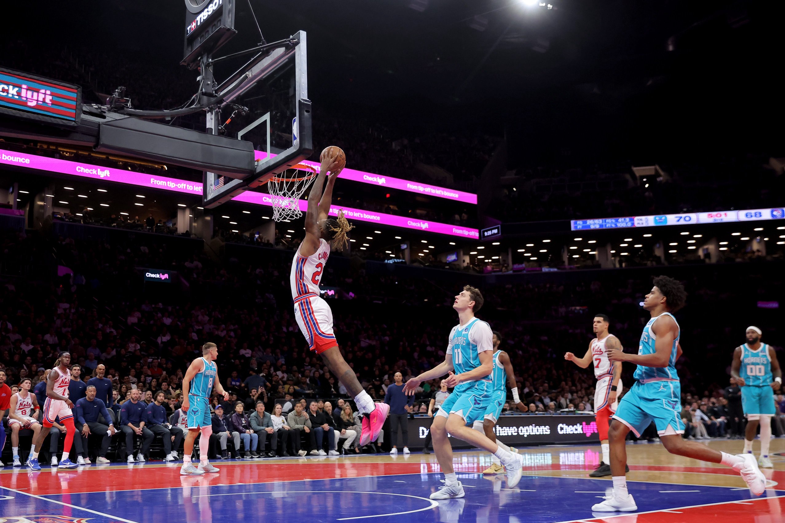 Oct 21, 2026; Brooklyn, New York, USA; Brooklyn Nets forward Noah Clowney (21) dunks against Charlotte Hornets center Ryan Kalkbrenner (11) during the third quarter at Barclays Center. Mandatory Credit: Brad Penner-Imagn Images