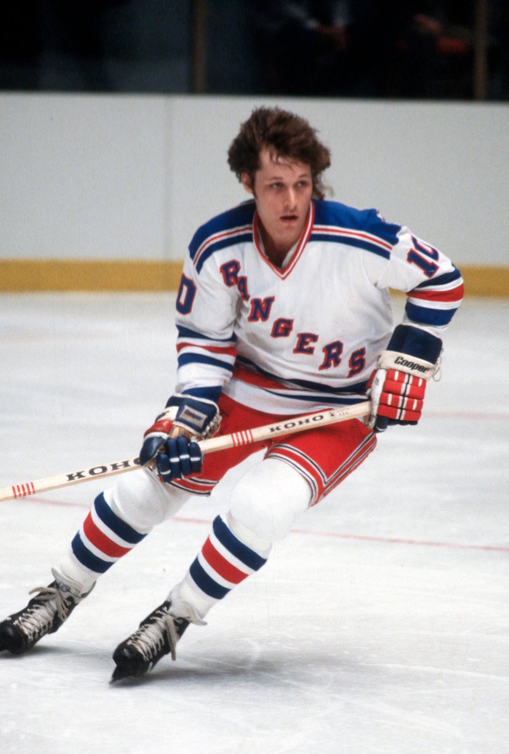 Ron Duguay of the New York Rangers skates on the ice with his hockey stick.