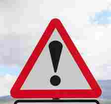 The triangle sign with an exclamation mark means there is a new hazard ahead