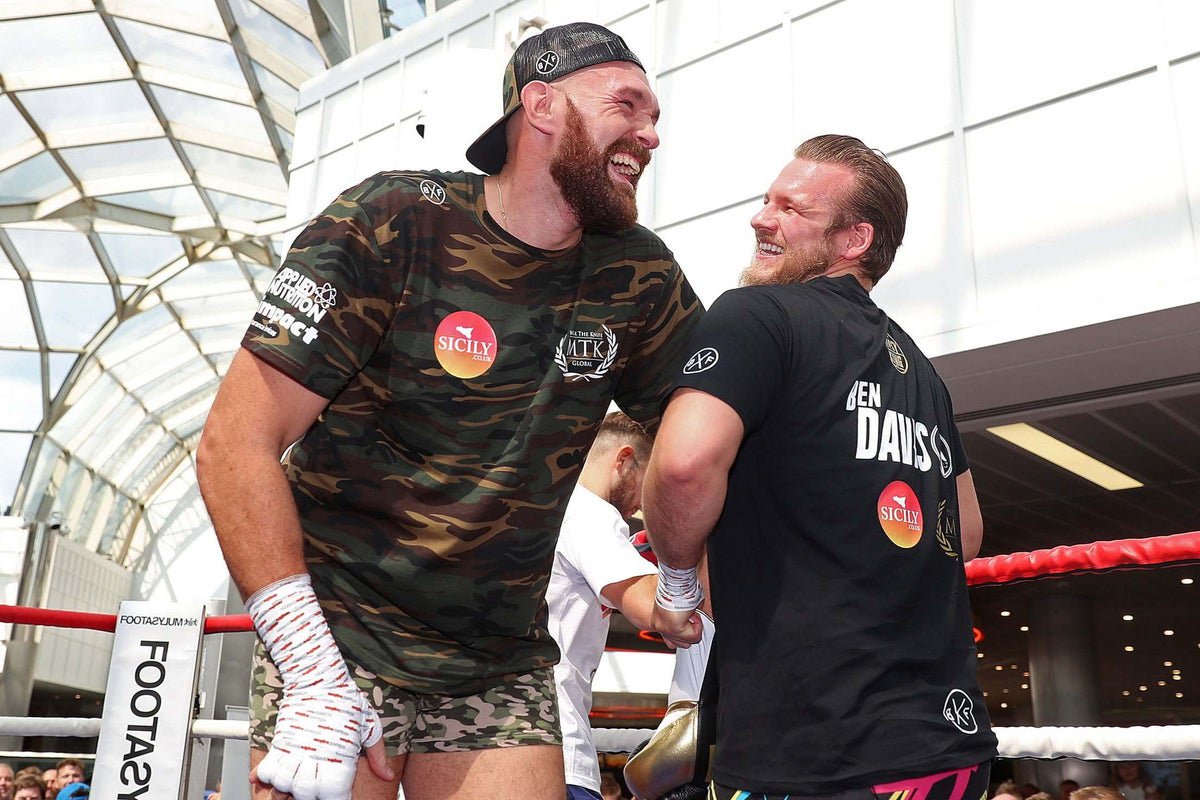 Tyson Fury (left) and his former trainer Ben Davison before their split (PA)