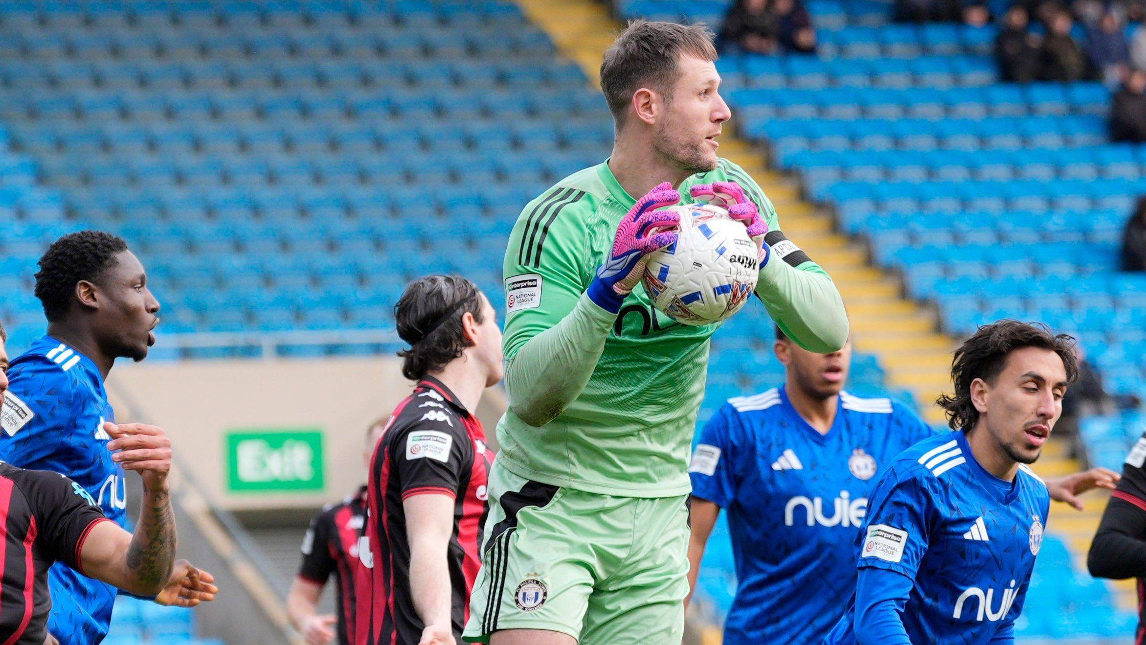 Halifax keeper Sam Johnson comes to collect a cross during the National League meeting between FC Halifax and Truro City at The Shay (14 February 2026)
