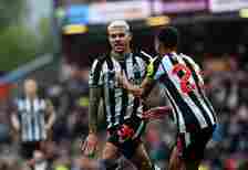 Bruno Guimaraes of Newcastle United (39) celebrates with teammate Jacob Murphy (R) during the Premier League match between Burnley FC and Newcastle...