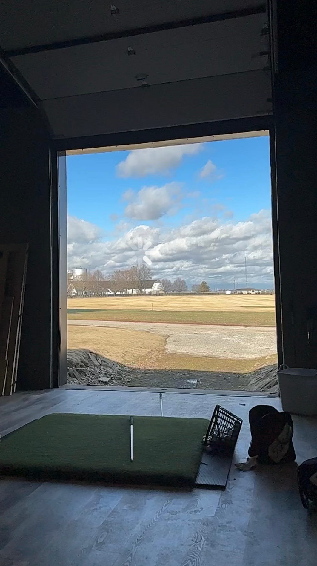 View from inside Adam Schenk's Golf Barn, where he practices in Vincennes, Indiana, including sometimes at night on the way home from the airport to test his latest swing theory.