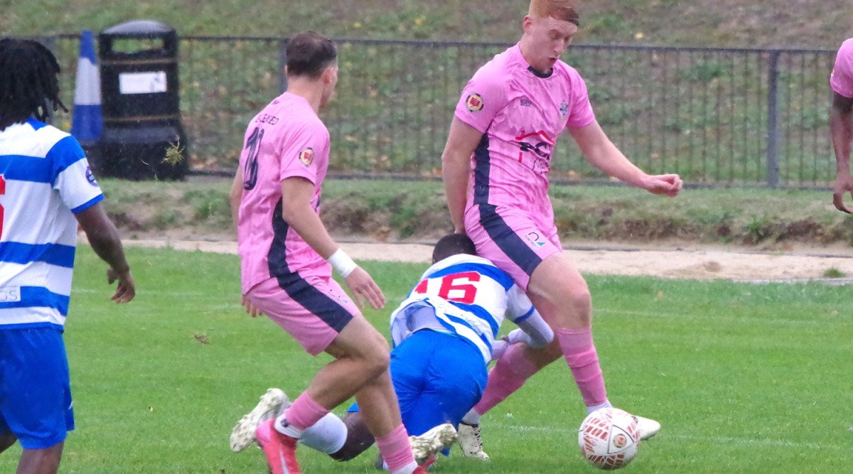 An Ilford player makes an unconventional challenge on Jaxon Brown and Alfie Osborne