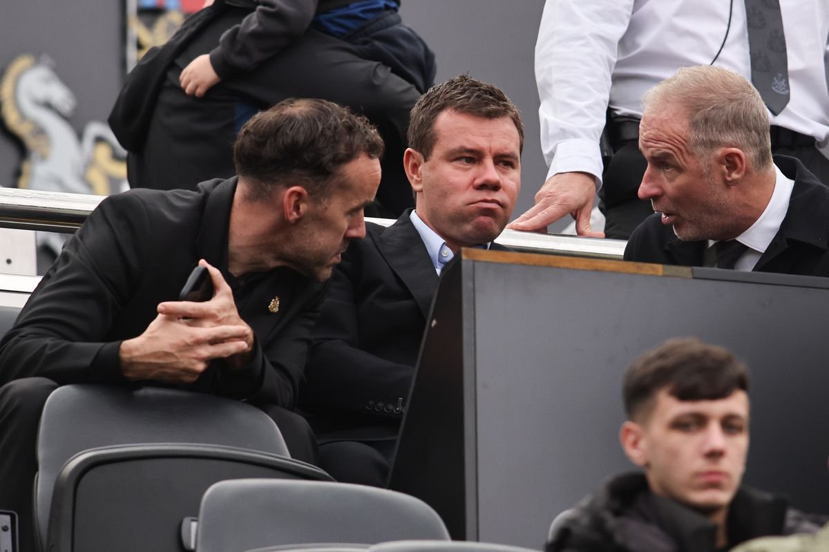 Newcastle United sporting director Ross Wilson (C) in conversation with CEO David Hopkinson (R) and performance director James Bunce (L)