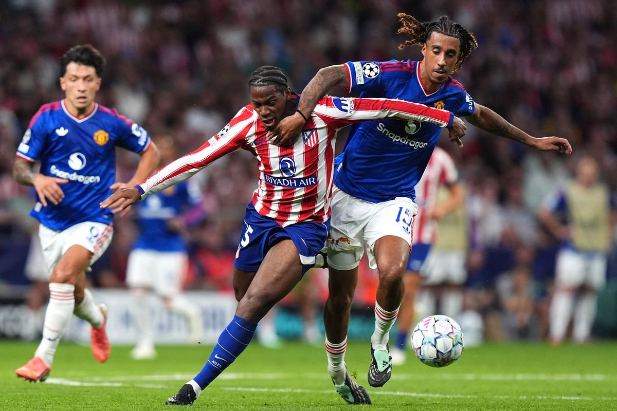 Jonathan David of Atletico Madrid is fouled by Leny Yoro of Manchester United which later results in a red card during the UEFA Champions League 2026/27 League Phase MD2 match between Atletico de Madrid and Manchester United at Estadio Metropolitano on October 13, 2026