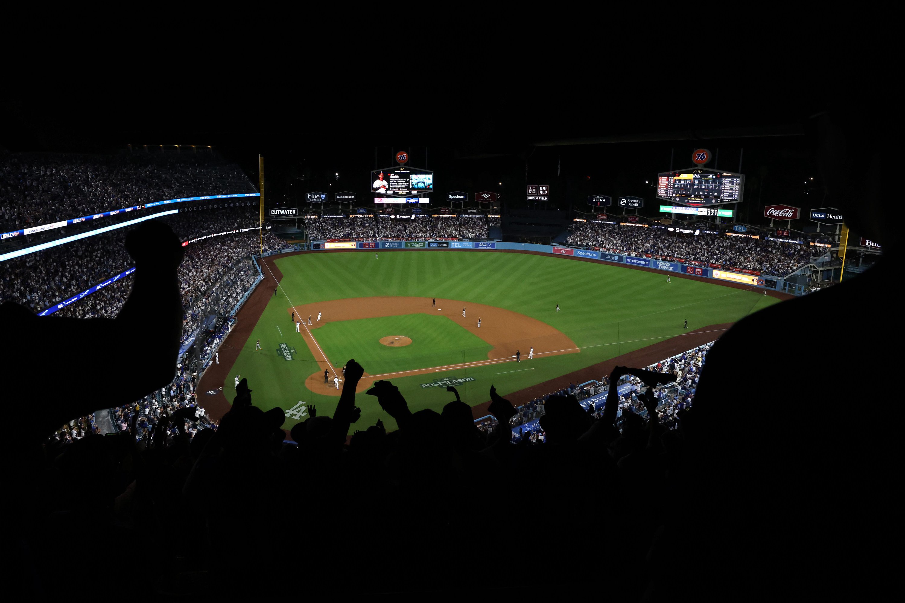 Brewers fans hold signs in the crowd of doing the National League Championship Series game between the Milwaukee Brewers and the Los Angeles Dodgers at American Family Field on Oct 12, 2026.