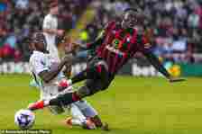 Manchester United's Aaron Wan-Bissaka, left, duels for the ball with Bournemouth's Dango Ouattara during the English Premier League soccer match between Bournemouth and Manchester United, at The Vitality Stadium in Bournemouth, England, Saturday, April 13, 2024. (AP Photo/Kirsty Wigglesworth)