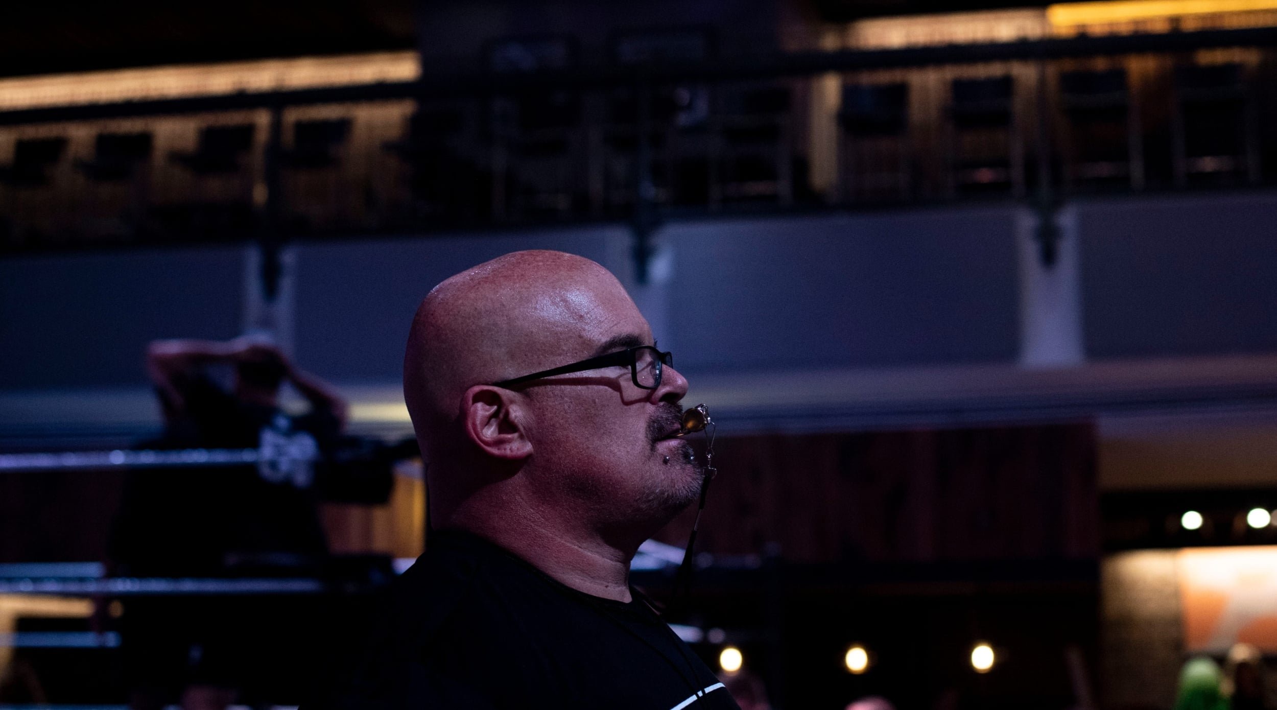 Matt Bloom blows the whistle signaling for competitors to switch drills during the WWE tryouts at Wildhorse Saloon in Nashville