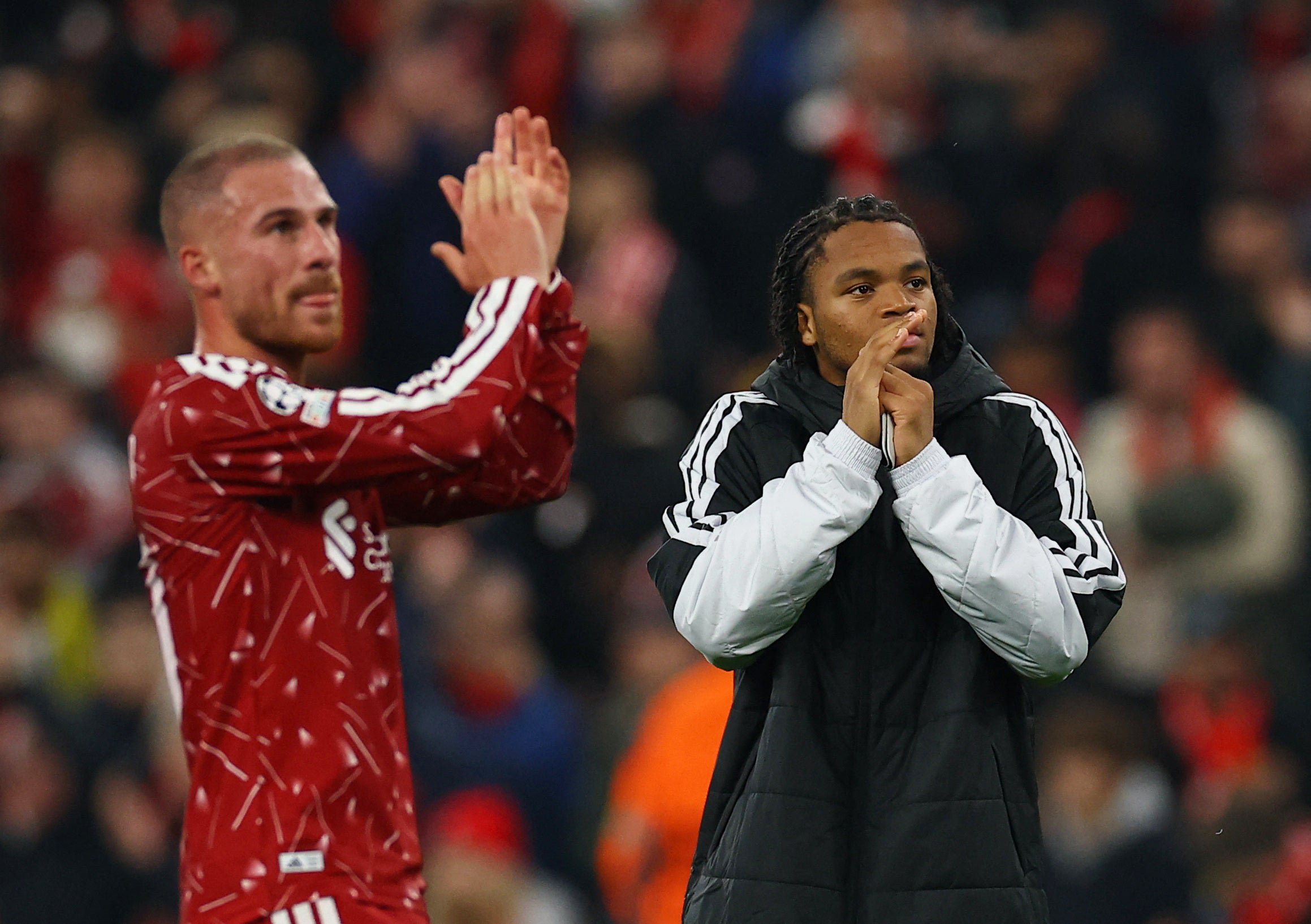 Liverpool's Rio Ngumoha and Alexis Mac Allister applaud fans after the match