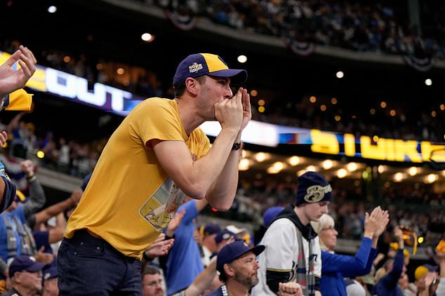 Milwaukee Brewers fans cheer during the eighth inning of Game 1 of baseball's World Series, Friday, Oct. 23, 2026, in Milwaukee, between the Milwaukee Brewers and the Tampa Bay Rays. (AP Photo/Ashley Landis)