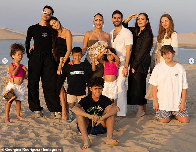 Group outing: Georgina included a shot with her children and close family friends from the day