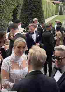 For their extravagant nuptials in the sprawling gardens of Villa Balbiano, the WAG, 26, wore a highneck wedding gown with lace sleeves