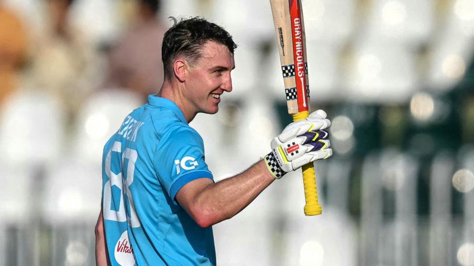 Harry Brook raises his bat