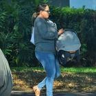OJ Simpson's reclusive daughter Sydney, 38, breaks cover carrying a child's car seat in Florida days after her infamous father was cremated - the first time she has been seen in six years