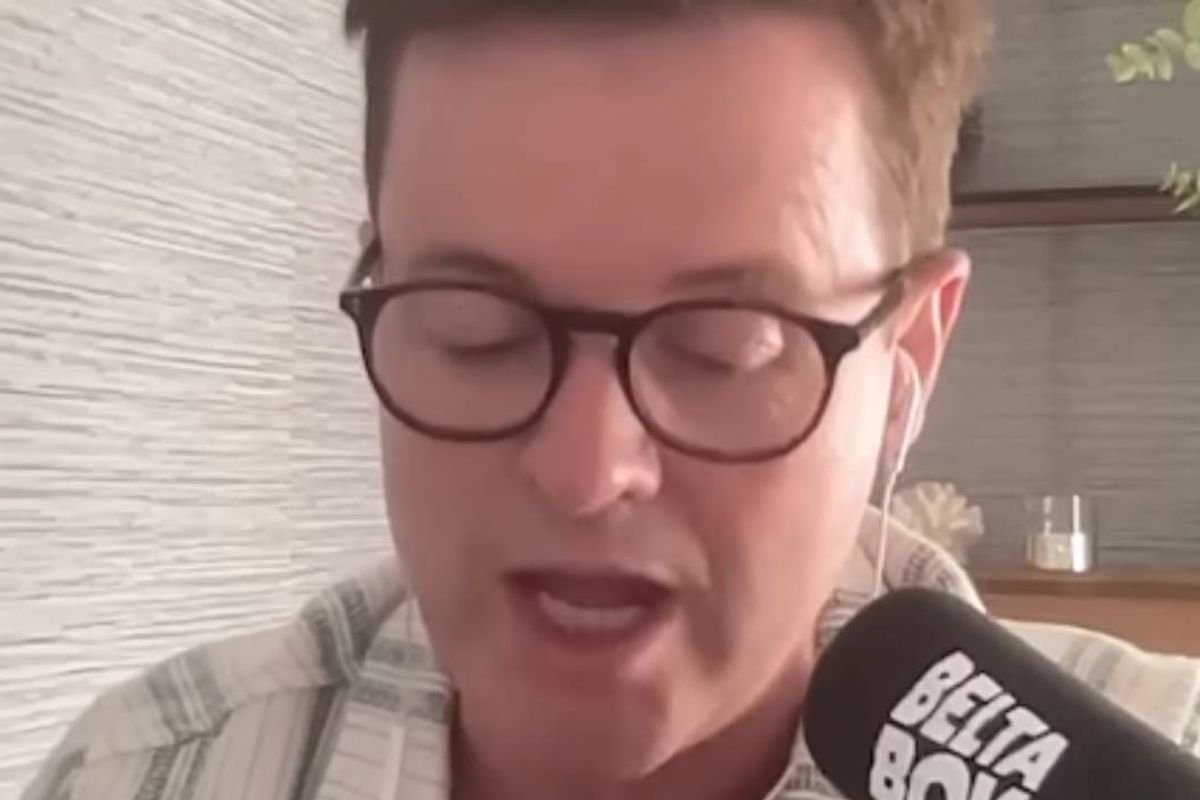 Declan Donnelly speaking into podcast microphone