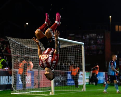 Jayden Wareham celebrates a goal for Exeter with a backflip.