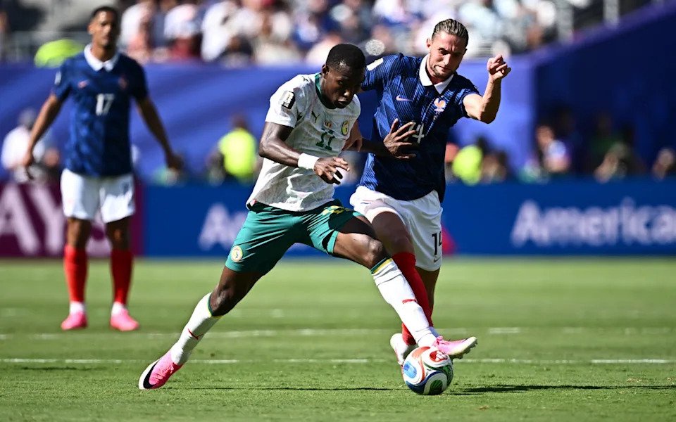Nicolas Jackson fends off France's Adrien Rabiot