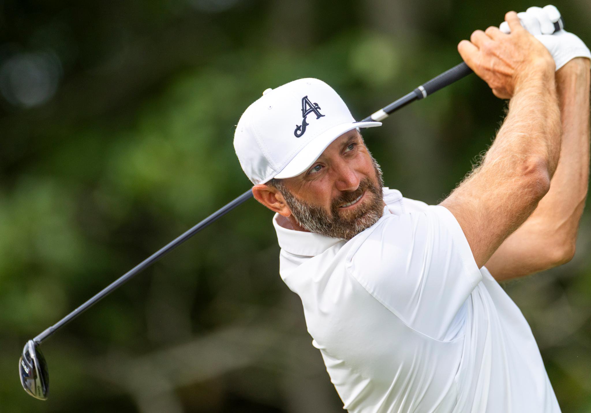 Dustin Johnson hitting a shot during the U.S. Open.