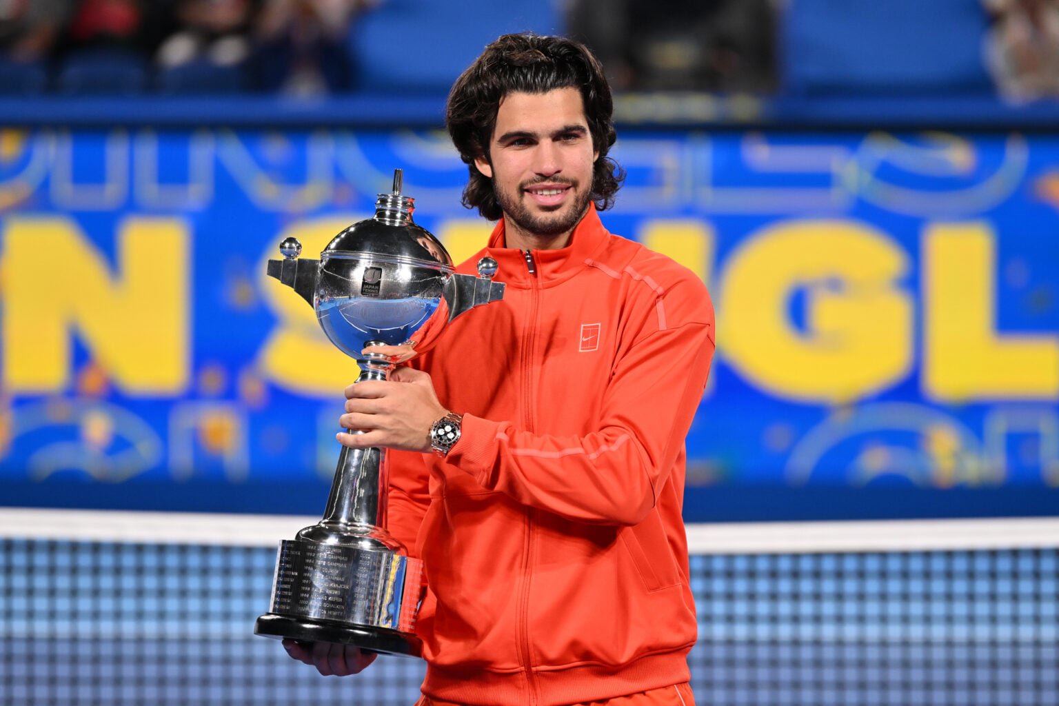 Carlos Alcaraz poses with the 2026 Japan Open trophy