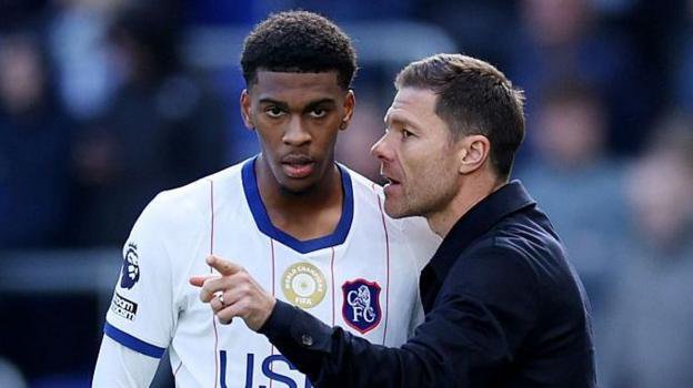 Josh Acheampong speaking to manager Xabi Alonso