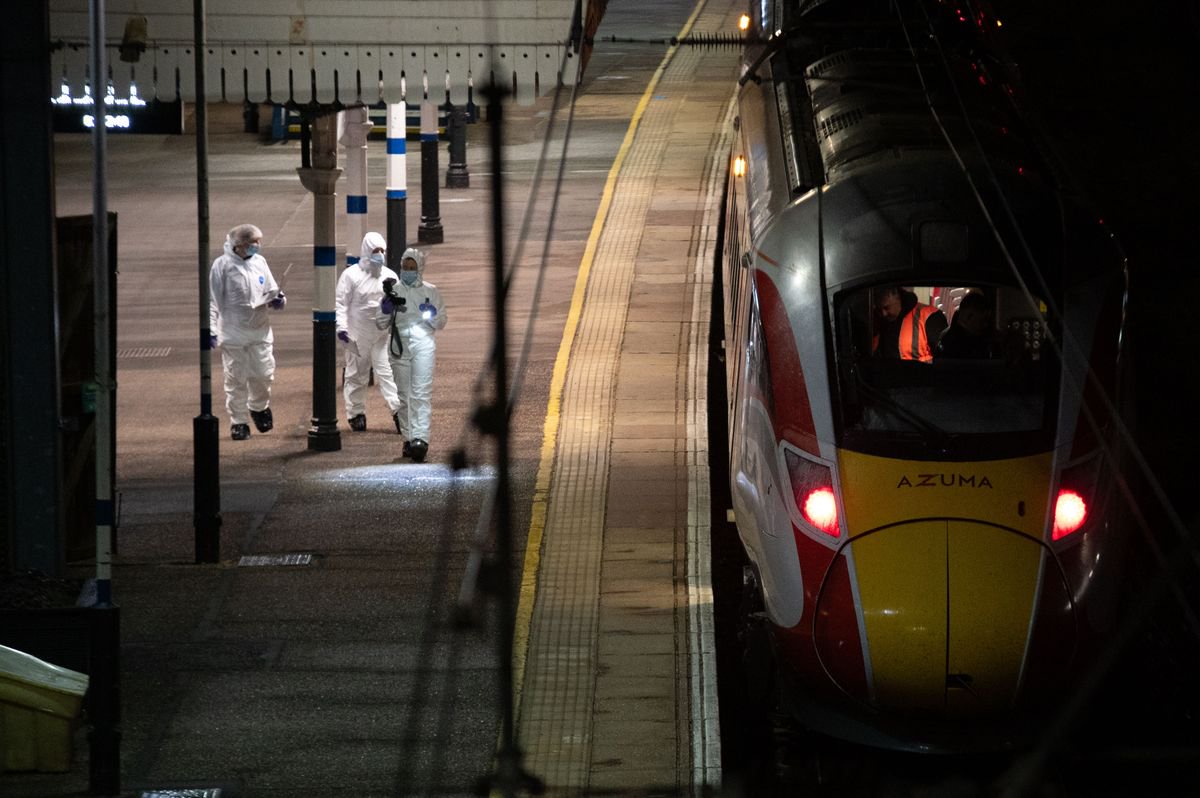 Forensics pictured at the station following the mass stabbing.