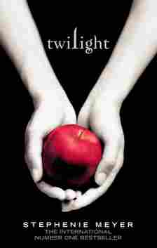 Hands holding an apple in the Twilight book cover.