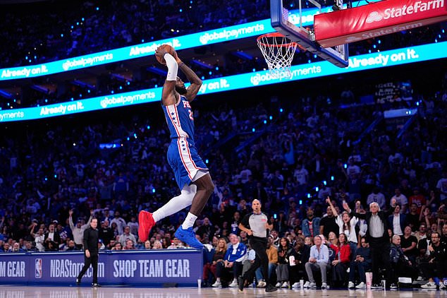 Philadelphia 76ers' LeBron James goes up for a dunk during the first half of an NBA basketball game against the Cleveland Cavaliers Thursday, Oct. 22, 2026, in Philadelphia. (AP Photo/Matt Slocum)