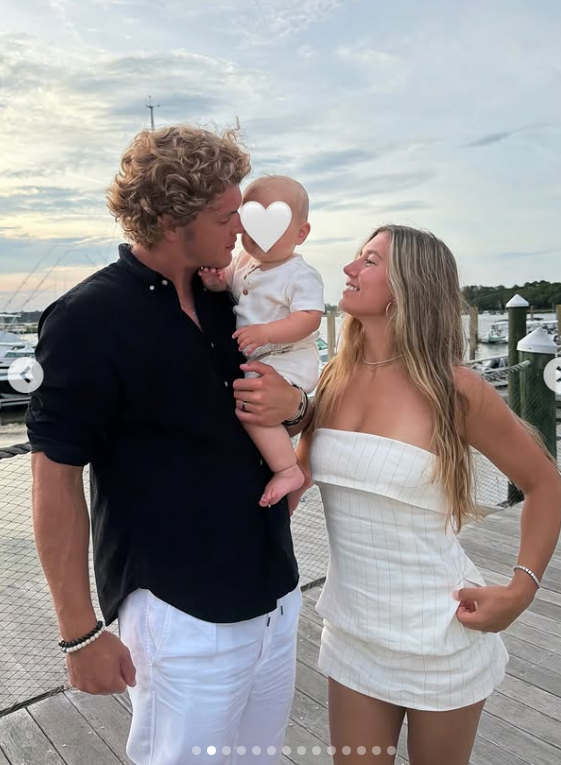 J.J. McCarthy and his wife Katya with their son, Rome. 