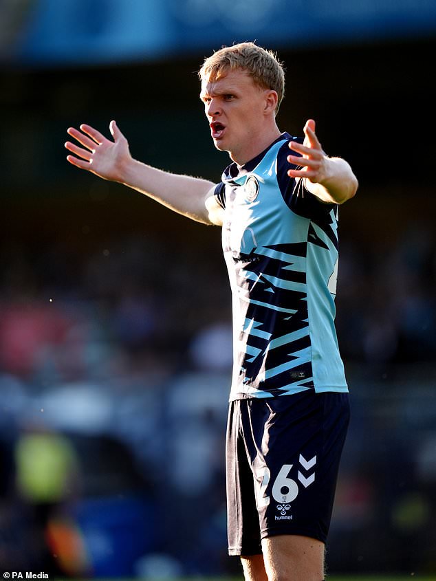 Connor Taylor scored a late own goal at Cambridge (John Walton/PA)
