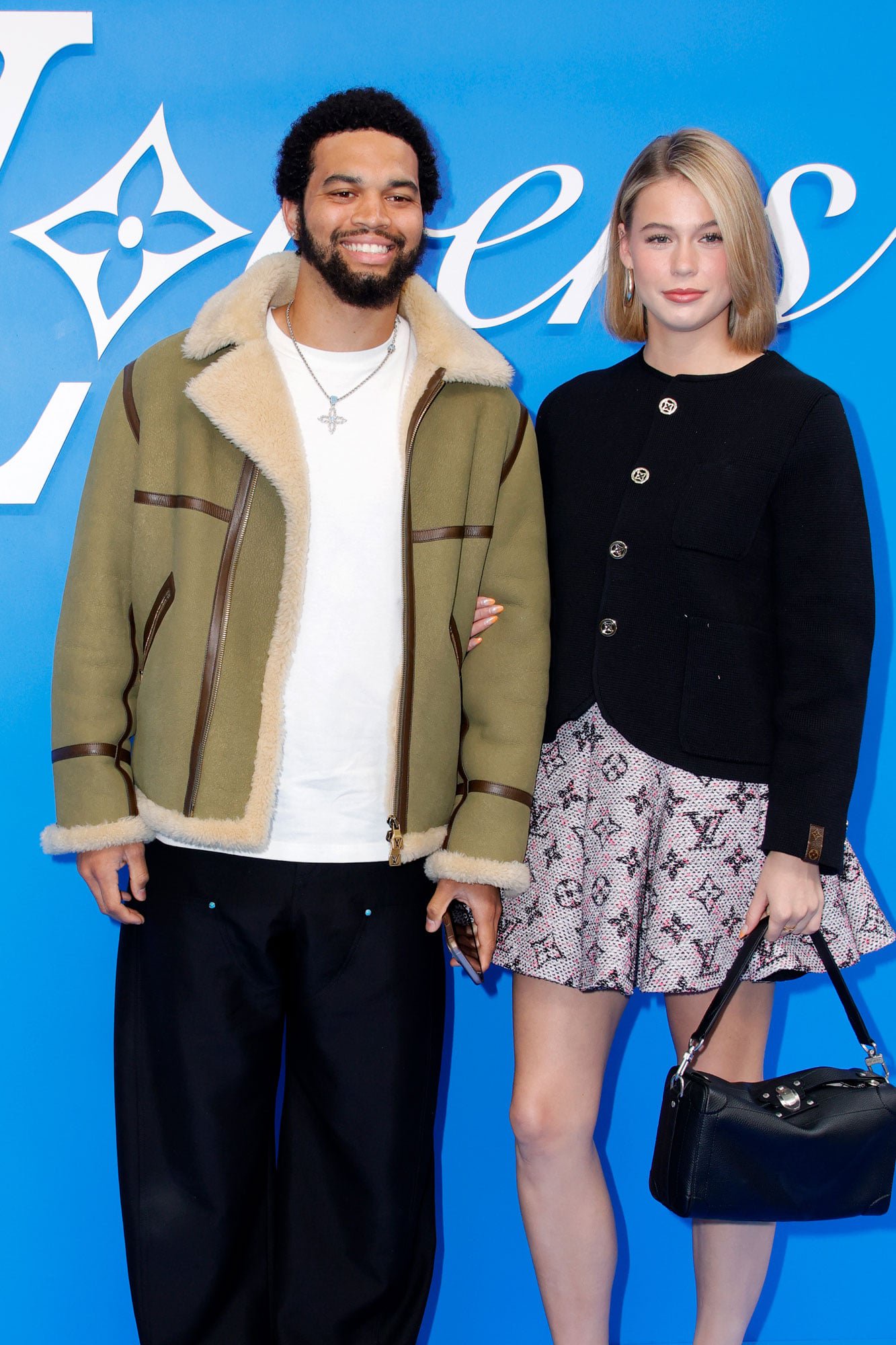 Caleb Williams and Alina Thyregod attend the Louis Vuitton Menswear Spring/Summer 2025 show as part of Paris Fashion Week on June 18, 2024 in Paris, France.