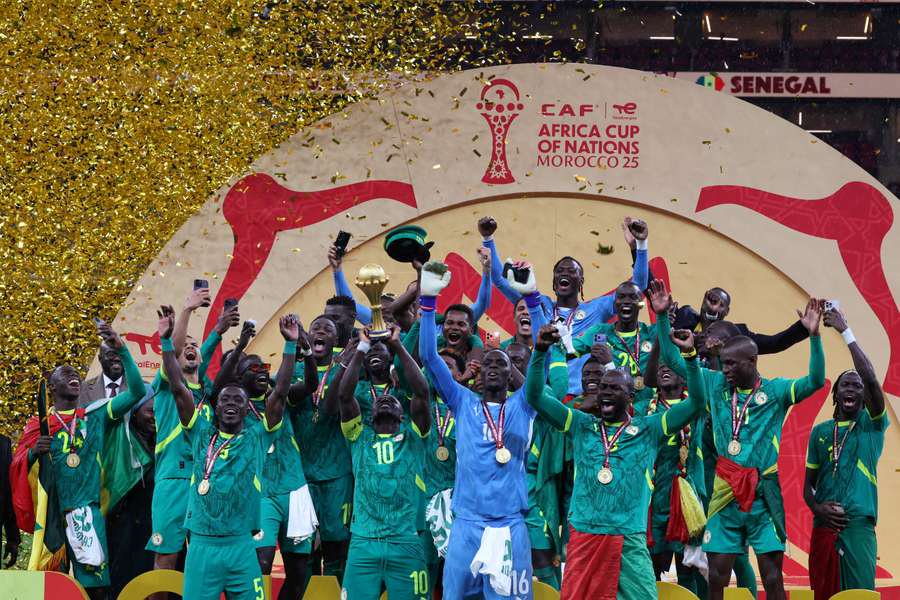 Senegal's Sadio Mane lifts the trophy with teammates as they celebrate after winning the Africa Cup of Nations in January
