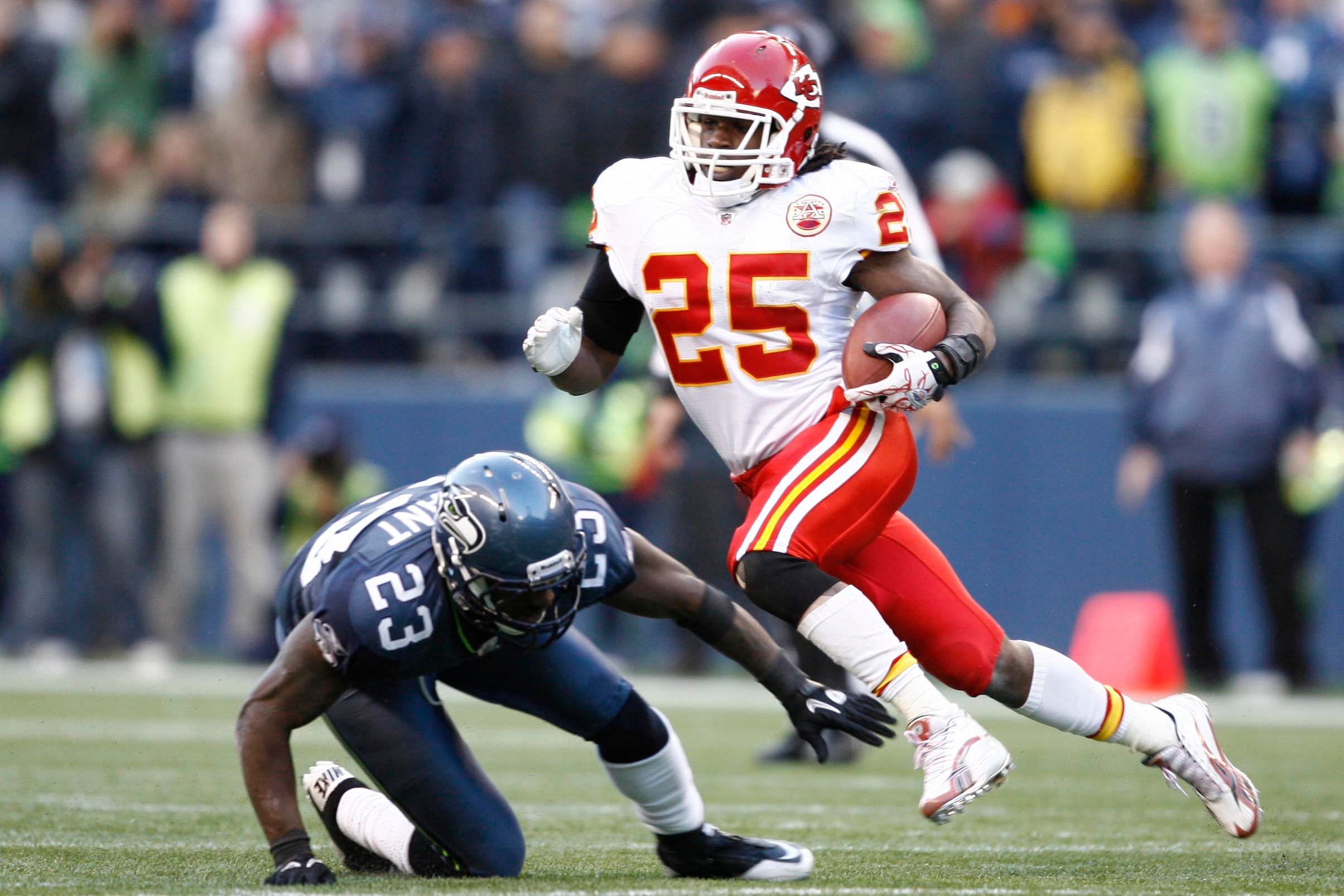 November 28, 2010, Seattle, WA USA; Kansas City Chiefs running back Jamaal Charles (25) dodges a tackle by Seattle Seahawks cornerback Marcus Trufant (23) during the second half at Qwest Field. Kansas City defeated Seattle 42-24. Mandatory Credit: Joe Nicholson-USA TODAY Sports